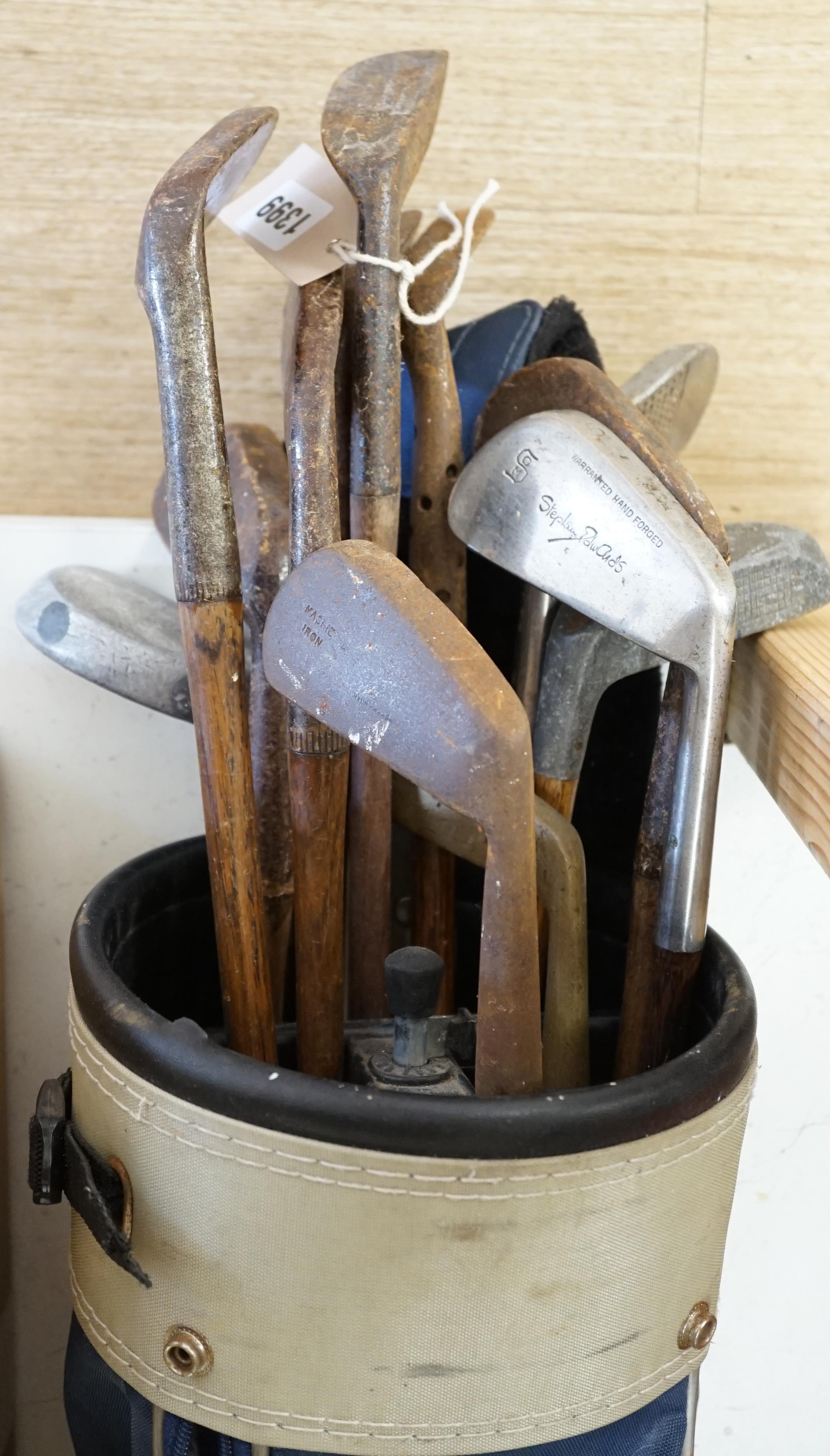 A collection of golf clubs, largely hickory shafted with two cases. Condition - varies